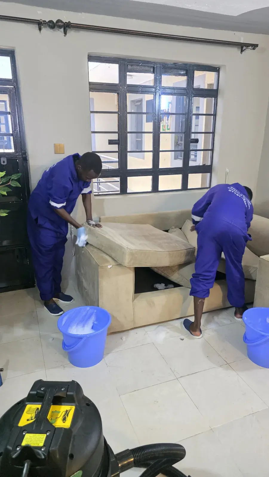 Soft Touch team cleaning a customer’s sofa